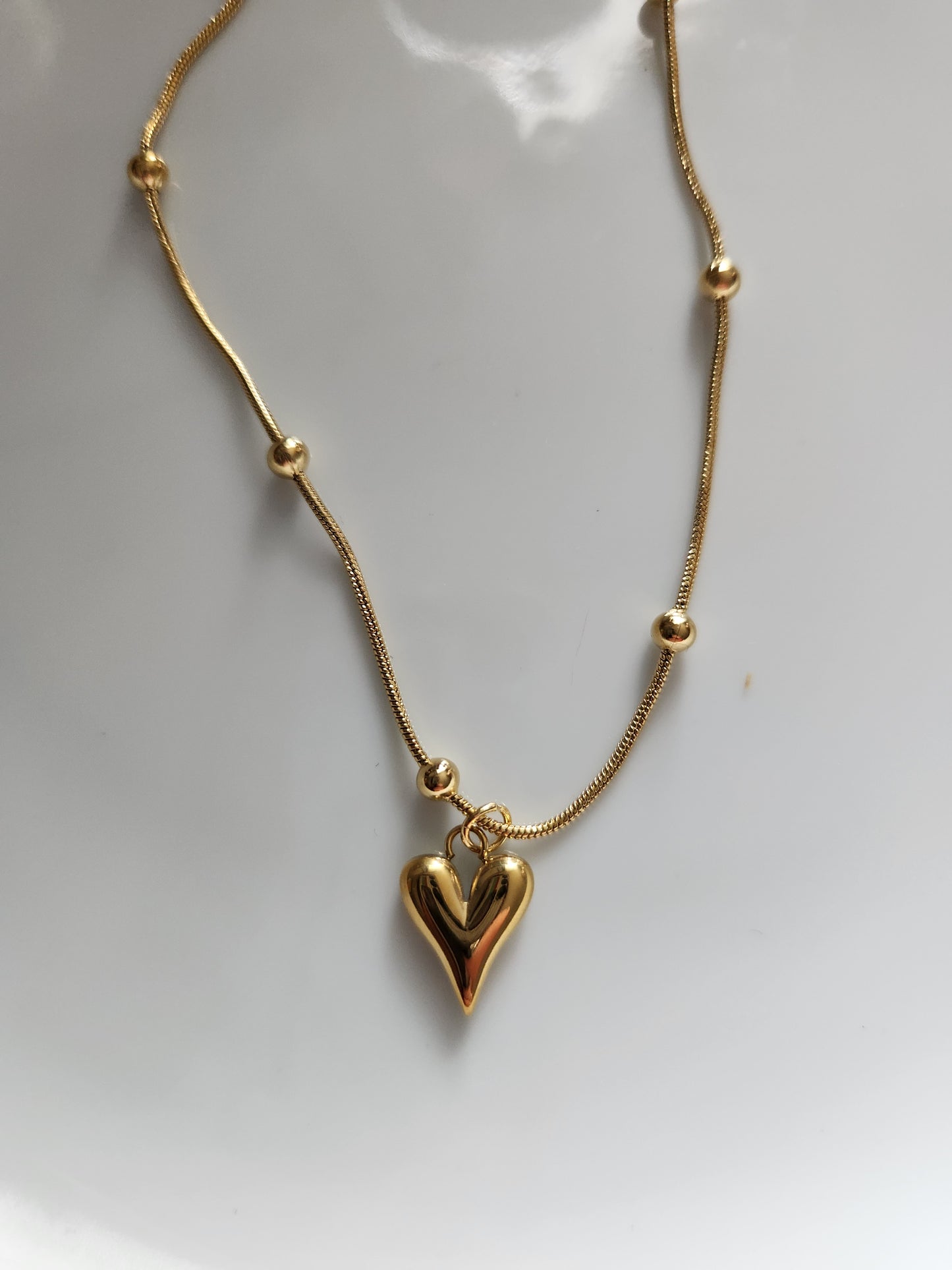 Gold beaded heart necklace