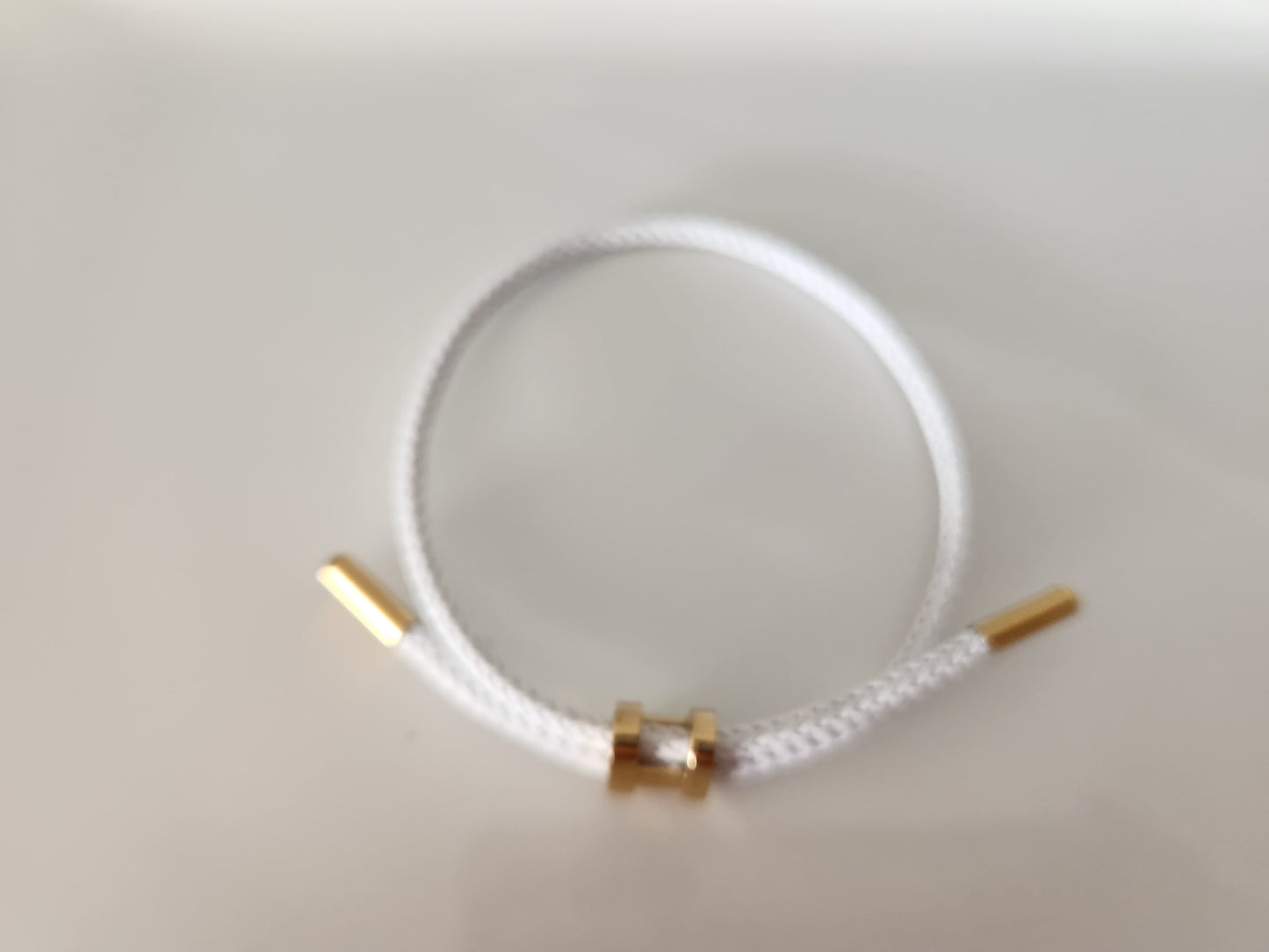 H White Cord Adjustable Bracelet